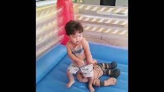 Little world wrestling champion slams doll around