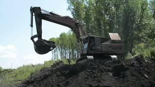 Old russian excavator EO-5124 loadin" KamAZ-5111