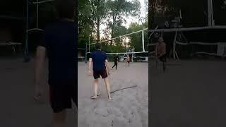 Beach volleyball, throwing the ball out of bounds.