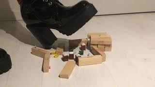 Giantess crushing a little fortified village