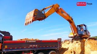 Excavators scoop soil (sand) onto trucks, dump trucks | MinhAn Toys