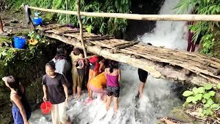 Village girls bathing at waterfall, Mizoram