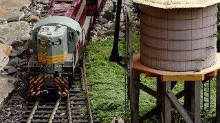 Couple creates tiny model train world in backyard