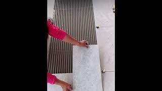 Wow check out and respect the skills of this floor tile guy.