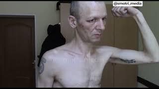 'Kraft macht frei' - captured Ukrainian soldier shows his tattoos