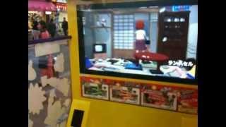 Serg playing a crazy arcade game where you flip a table over in Shinjuku Arcade