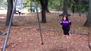 Emily on the swings