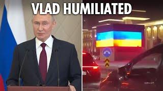 Moment Putin is HUMILIATED by 'hackers' as motorcade is forced to pass giant Ukraine flag