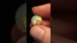 stunning bright colors on this round opal! #gemstone #opal #opalcabochon