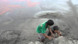 Children making Sandcastle at the bank of Holy Rever Ganga Haridwar