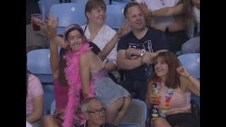 Woman in crowd shakes booty during Rugby sevens at the Commonwealth Games