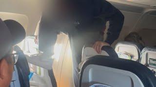 Shocking video shows man repeatedly kicking plane seat | SWNS