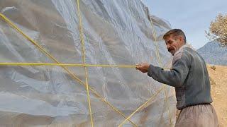 Jahangir's attempt to cover the roof of the kitchen with plastic and rope