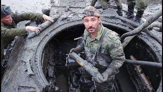 A T-34 TANK FROM THE SECOND WORLD WAR WITH THE DEAD CREW WAS TAKEN OUT OF THE RIVER