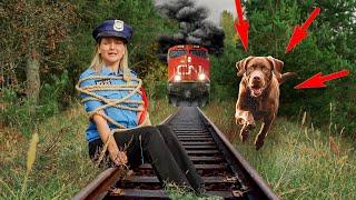 Puppy Rich and the detective save a friend / Rich the dog saves a detective on the train tracks