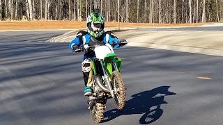 10 year old does max speed on a dirt bike. Kawasaki kx65 new!