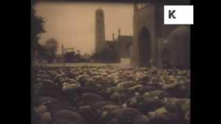 Archive footage of Afghanistan, street scenes, women, men praying