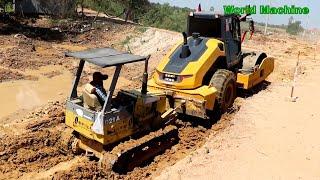 Drum Roller Stuck At Work And Recovery By Mini Bulldozer, Construction Machinery At Work