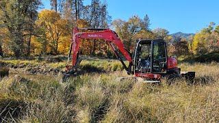 Shaping up a small cow pond with the Kubota KX 080 4