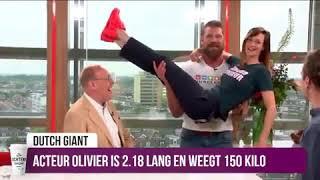 Strongman overhead lifts woman 7