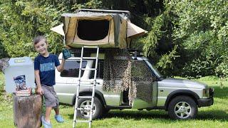 Father and son camping together - Land Rover Discovery 2 Td5 and ROOFTOP TENT