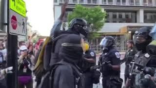 7ft tall anonymous Spec ops guy at DC protest bullying and intimidating police