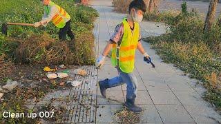 Two guys cleaning the sidewalk makes people feel good. Clean up 007