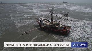 Shrimp boat washed up along Port Aransas seashore