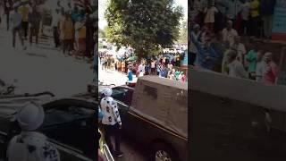 Karangu wa muraya flees from an angry crowd in Muranga town with a police car