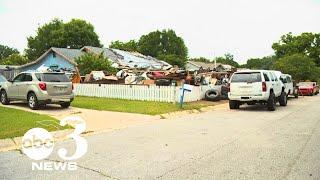 Pensacola home under scrutiny for growing trash pile in front yard