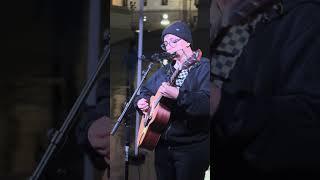 playing harmonica in the rain at the Capitol for "daughter"