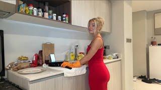 Charlotte Parkes cooking in a Red Dress