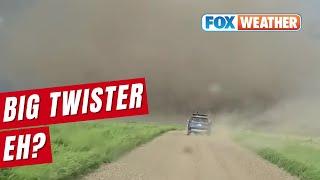 Tornado Rolls Across Road In Front Of Storm Tracker In Canada