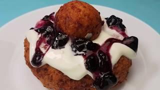 The fluffiest Romanian Papanasi (cheese donuts with sour cream and fruit preserve)