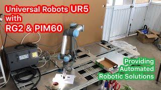 Universal Robots UR5 with Sick PIM60 and Onrobot RG2