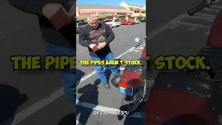 Traffic officer pulls over biker for loud noise. ‍