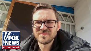 Separated from family, Ukrainian father describes escaping Kyiv