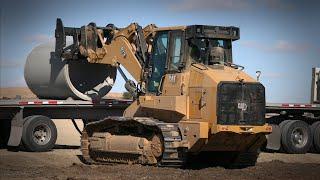 Cat® 973 Track Loader | Unloading Pipe