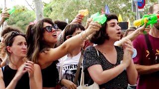 Protesters Spray American Tourists With Water Guns in Spain