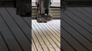 CNC machine with googly eye and monster teeth upgrade. It munches  carbon and metal even better!