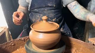 making a classic clay pot on a potter's wheel