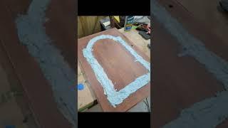 Using bondo to resurface a buffet door. #robertandmollybees #bondo #furnitureartist #art