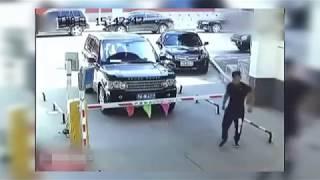 Car stucked at the parking barrier! Watch what happens!   