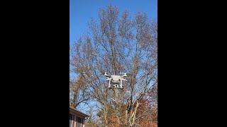 Using a drone to hang an antenna.