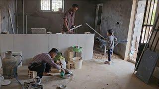 Master Mustafa fixed the sloped kitchen floor and painted a comedy wall