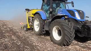 Seeding winter wheat after sunflower with Claydon Evo M3F pulled by New Holland tractor