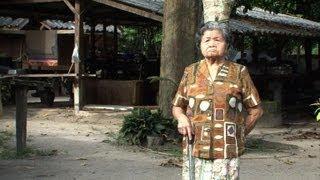 Lone Buddhist widow holds out in war-torn Thai village