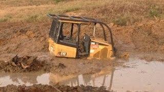 Stuck Caterpillar Dozer! While digging out pond, buried over the tracks!