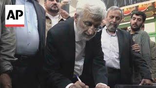 Hard line and reformist candidates both vote in Iranian presidential runoff