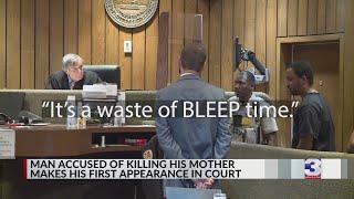 Man charged with murdering mother curses in court